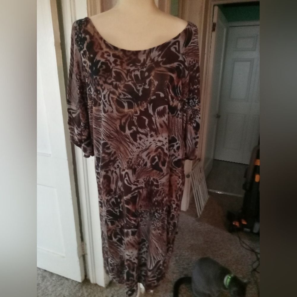 DOTS poly/spandex knit dress with cut-out sleeves. Animal print/gold accents